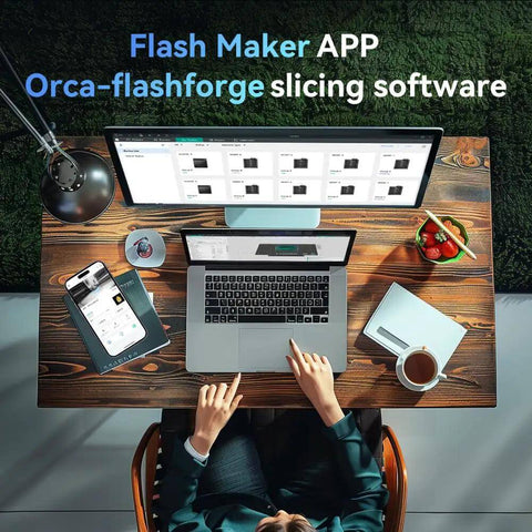 Person using a laptop and tablet with Flash Maker APP and Orca-flashforge slicing software at a wooden desk.