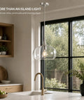HXXLFONEDP Glass Pendant Light for Kitchen Island, 10 Inch, Brushed Nickel hanging over a kitchen sink with clear glass shade.