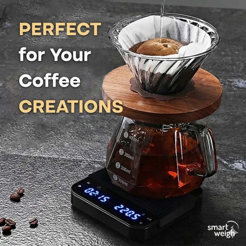 Precision Coffee Scale With Timer For Espresso And Pour Over on table with glass carafe and wooden dripper.