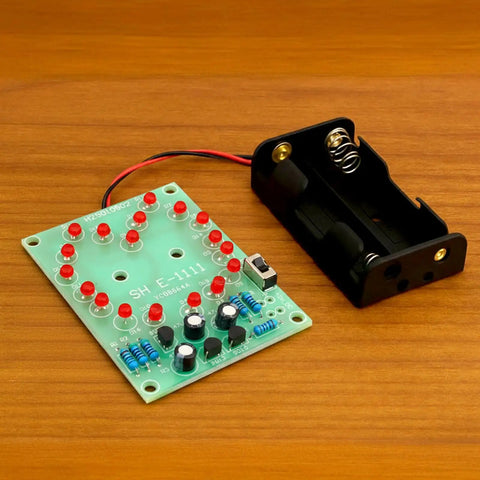 Two Sets Solder Practice Kit With Heart Shaped LED Lucky Wheel DIY Soldering Project, circuit board and battery holder on table