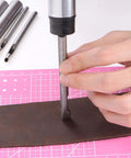 Using 9 Piece Stainless Steel Leather Hole Punch Set With A5 Cutting Mat For Leather, Canvas on brown leather strip