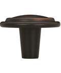 Traditional Round Cabinet Knob In Oil Rubbed Bronze Finish With Subtle Copper Highlights, 1 1/4 inch size, ideal for drawers.