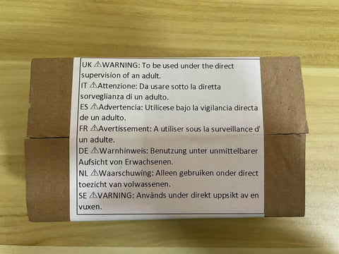Cardboard box with multilingual warning label advising adult supervision for usage.