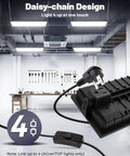Two Pack Linkable LED Shop Lights 100W 15000LM 6000K Daylight Brightness Plug In Garage Light With 9.84ft Cord Built In Outlet in workspace