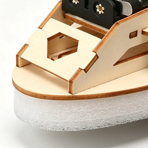 Close-up of Wooden Vehicle Model Kit For Hands On Mechanical Engineering Fans showing precision-cut wood components