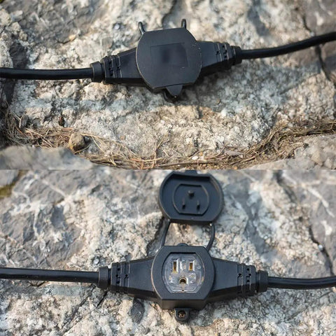 Beefy 50 Foot 14 Gauge Heavy Duty Extension Cord with Eleven Evenly Spaced Sockets, outdoor close-up on rocky surface