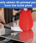 Using Beefy Dual Edge 3D Printer Scraper Kit With Curved And Straight Blades to remove red vase from build plate.