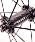 Close-up of the carbon hub on 700C Road Bike Wheelset With Aluminum Rim And Carbon Hub, V Brake Quick Release For 7 To 11 Speed Cassettes
