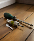 40 Pcs Cam Lock Furniture Fasteners Dowel Pins Kit For Wardrobe Panels And DIY Furniture with screwdriver on wooden floor