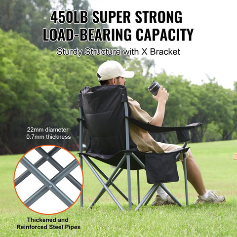 Man sitting in Oversized Camping Folding Chair With Quad Lumbar Back Support, showcasing load-bearing capacity outdoors.
