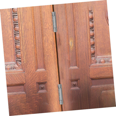 NUOBESTY pair of double swinging self-closing door hinges installed on brown wooden double doors (front view)