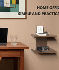 Wall Mounted Two Tier Floating Media Shelf In Rich Walnut Brown For Projectors And DVD Players With No Sweat Cable Routing And Heavy Duty Build To Secure All Your Rec Room Entertainment Gear in a home office setting with decor.