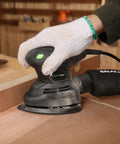 Person using Detail Sander 1.7A 15000 OPM Compact Electric Sander With Handy Dust Bag on wood surface in workshop