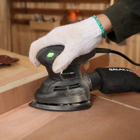 Person using Detail Sander 1.7A 15000 OPM Compact Electric Sander With Handy Dust Bag on wood surface in workshop