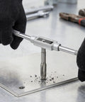 Using Tap And Die Set 60 Piece Pro Grade SAE And Metric Threading Kit For M3 Through M12 On metal plate