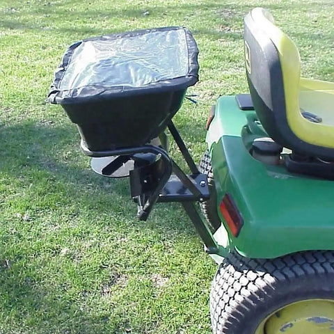 Tow Behind 12V Lawn Tractor Spreader For Grass Seed And Fertilizer With 80 Pound Capacity attached to tractor