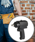 Compact Mini Pneumatic Impact Wrench Featuring Aluminum Alloy Chassis And Ergonomic Non Slip Handle in a workshop setting.