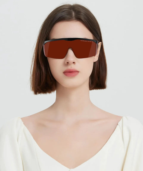 Built Tough Laser Safety Glasses Bringing Game Changing Od Five Plus Coverage From One Ninety To Five Fifty Nanometers And Eight Hundred To Eleven Hundred Nanometers Anti Fog Goggle For Ipl Laser Hair Removal Crews worn by a model with a neutral background.