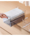 Heavy Duty Side Mounted Ball Bearing Drawer Slides Full Extension Double Row Premium Steel Glide smoothly supporting a clear storage box with folded clothes.
