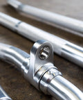 Straight Up Heavy Duty Aluminum Curl Bar Attachment Compatible With Cable Machines features a close-up of durable aluminum material.
