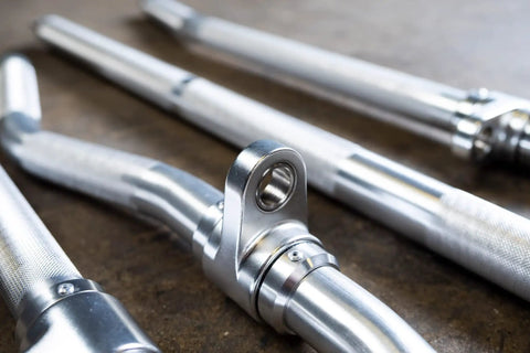 Straight Up Heavy Duty Aluminum Curl Bar Attachment Compatible With Cable Machines features a close-up of durable aluminum material.