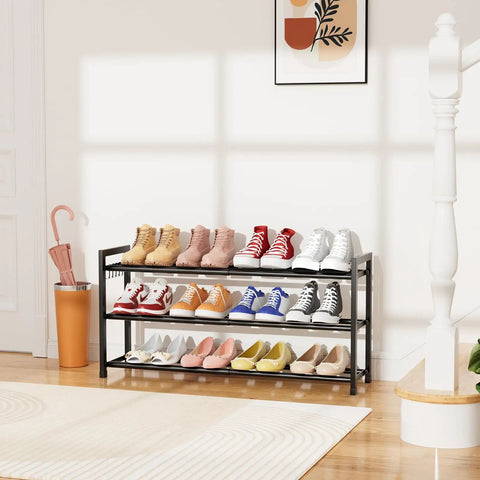 Space Saver Expandable Shoe Rack 18.5 To 33 Inches Wide 3 Tier Metal Shoe Organizer No Tools Assembly For Entryway Closet Bedroom Garage Dorm Free Standing Holds 12 Pairs With Hooks Black displaying various shoes in a bright living space.