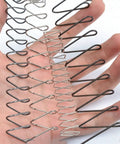 Extension Compression Springs Kit With Pro Grade Spring Steel Rectangular Wire Springs displayed on hand