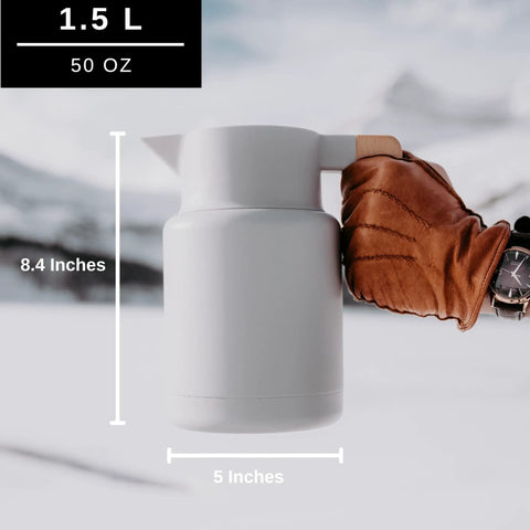 50 Oz Thermal Coffee Carafe Stainless Steel Insulated Dispenser Keeps Your Brew Hot Or Cold For Hours With Tea Infuser And Strainer Large One And A Half Liter Double Wall Vacuum Bottle Gray Finish Easy Pour, side view held by hand with dimensions shown.