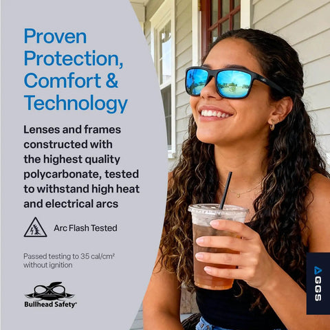 Woman wearing Pompano Glasses With Performance Fog Technology Polarized Lenses Ultra Lightweight And Scratch Resistant Eyewear For Cycling Fishing And Driving Slick Anti Fog Sunglasses Ice Blue Matte Black, holding a drink and smiling outdoors.