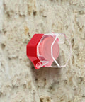 Power Switch Lockout Cover for Emergency Stop Buttons and Push Switches, clear plastic and red, mounted on wall, 2.95x2.16x2.16 inches