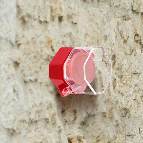 Power Switch Lockout Cover for Emergency Stop Buttons and Push Switches, clear plastic and red, mounted on wall, 2.95x2.16x2.16 inches