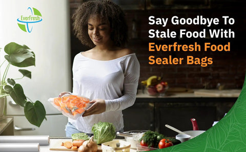 Woman in kitchen holding vacuum-sealed bag with sliced carrots, surrounded by vegetables and kitchen tools