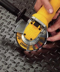 Powerful 9 Amp Four And A Half Inch Angle Grinder With Paddle Switch And 12,000 RPM Motor in use on metal surface
