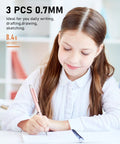 Girl writing with Cute 0.7mm Mechanical Pencil Set With Case, pastel pink pencil, suitable for drafting, drawing, studying.