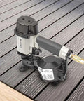Pro Grade Coil Roofing Nailer Fires 1-3/4 Inch 15 Degree Fasteners with aluminum body on wood deck.