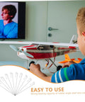 Child using a toy airplane with 20 Pack Heavy Duty Metal RC Airplane Linkage Stoppers Plus Adjustable Push Rod Connectors For Fixed Wing Models Quick Swaps DIY Mods Rock Solid Flyin Gear.