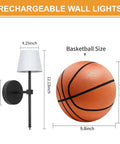 FRIDEKO HOME Black Battery Operated Wall Sconces Set of 2 Small, 12.2in. dimensions alongside a basketball for size reference.