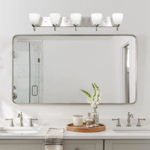 Armada 36 Inch Five Light Modern Vanity Light with brushed nickel finish and frosted glass shades above bathroom mirror.