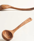 Premium Italian Olive Wood Ladle Kitchen Spoon That Totally Slaps With 12 Inch Long Handle and Deep Bowl Head For Cooking Soup Naturally Handcrafted Non Toxic Serving Tool on a light background.