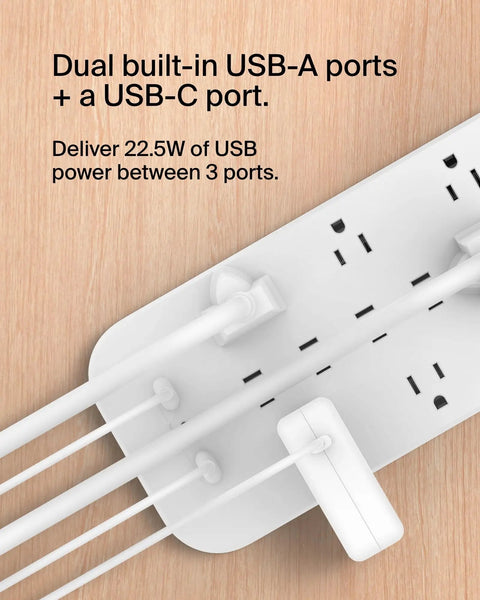 12 Outlet Surge Protector Power Strip With 12 AC Outlets, 2 USB A Ports And 1 USB C Port, white design on wooden surface