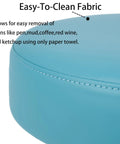 Close-up of the easy-to-clean fabric on the Adjustable Height Rolling Task Stool Built Tough For All Day Grind With Plush High Density Foam Cushion.