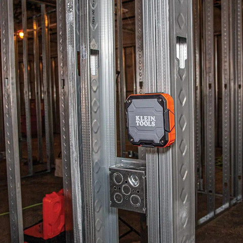 Rugged Bluetooth Speaker With Magnetic Strip And Hook attached to metal frame at construction site, wireless and dust resistant