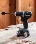 Sub Compact Brushless Cordless Drill Driver Kit With Metal Chuck And Two Speed Gears Built For Tough Jobs And Tight Squeezes Hella Smooth Ride For Tradesmen on a workbench.