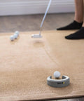 Golf Putting Cup Accuracy Trainer in Horseshoe Shape for Home and Office Practice on a carpet with golf balls and putter
