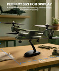 Model of X550 RC Plane For Beginners And Adults, 4 Channel Remote Control Airplane with military look on display stand.