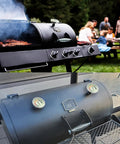 Outdoor barbecue grill with Three And One Eighth Inch Luminous BBQ Thermometer Gauge Replacement For Smokers And Grills visible