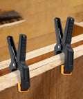 10 Pack Heavy Duty Spring Clamps For Woodworking And DIY Projects Tough Nylon Frame With Steel Spring Multipurpose Clips in use on wood