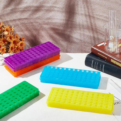Polypropylene Microcentrifuge Tube Rack Set in multicolor display for lab use, featuring five-color assorted stands on table