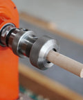 Crush Complex Turns On Your Lathe With This Badass ER32 Collet Chuck Kit featuring a wooden blank secured in a silver collet chuck.