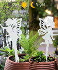 2 Pack Metal Fairy Hanging Lantern Solar Outdoor Garden Stakes with Silhouette Lights by day and night in garden